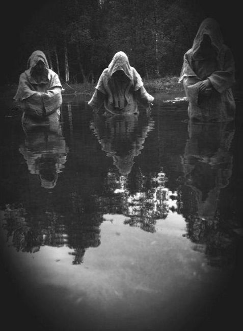 Cult members hailing their dark god